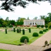 The Orangery, Belton House, Belton, Lincolnshire. The Orangery seen from across the formal gardens.