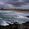 A view over Fistral-Beach, backround Headland-Hotel in Newquay