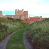 Bamburgh Castle from the old road, Northumberland.