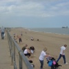Ingoldmells beach with a ship doing work in the sea.
