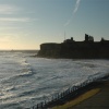 Tynemouth Castle and Priory, and North Pier with South Pier behind.