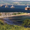 View of the Oil Rigs in the Cromarty Firth looking over the village of Cromarty
