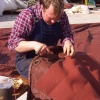 Repairing a sail at Maldon's busy boatyard.