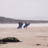 Surfers on steaming beach at Croyde in Devon 28/04/2006