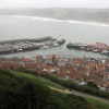 Scarborough, North Yorkshire. Old Harbour in mist from castle