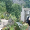 Looking towards Peak Cavern from the river at Castleton