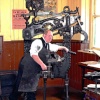 Printer at work in early 20th century dress , Beamish Museum 2006