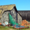 Old fishing boats converted into huts on Holy Island, Northumberland.