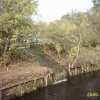 Fishing Pond overflowing into the river Tame at Reddish Vale, Stockport