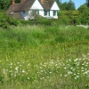 A view across Mayford Pond to Sun Hill House beyond.  June 2006. Mayford, Surrey