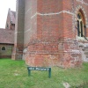 Sign leading to the Alice Memorial at Saint Michael and All Angels Church, Lyndhurst, Hampshire