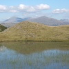 Stickle Tarn set high up on Stickle Pike near Ulpha, Duddon valley.  Scafells in the background.