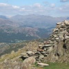 Top of Stickle Pike near Ulpha, looking to Esk Pike, Bowfell and Crinkle Crags.