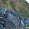 Granite boulders placed to stem erosion of the sea cliffs at East Runton, Norfolk