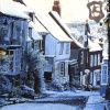 Painting of Mermaid Street, Rye, in the snow by Colin Bailey