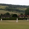 Cricket game with Box Hill in the background in Dorking, Surrey July 2006