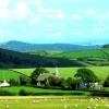 The Countryside a couple minutes away from Ulverston, Cumbria, looking onto a church and houses.