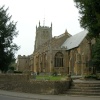 All Saint's Church with Rememberance Day monument in foreground, Martock, Somerset