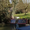 A tree-house (with owner, eating sandwich) by the Oxford canal, Lower Heyford, Oxfordshire.