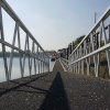 Footway leading to boats/barges moored at the side of the River Trent at Beeston, Nottinghamshire.