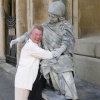 Street entertainer with tourist in Bath, Somerset