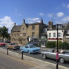 Classic cars driving through Chipping Norton