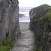 Rock-cut path to the beach at Lansallos cove in Cornwall