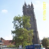 The parish church, with Glastonbury Tor in the far distance