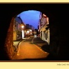 Tenby through castle archway
