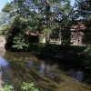 The River Avon flowing beneath Cranebridge Road, Salisbury,Wiltshire