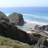 The tide leaves blue pools of water on the beach at Bedruthan Steps, Cornwall