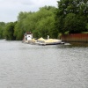 Workboat and barges entering the lock cut past the Boat Inn
