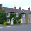 Lovely stone cottages in Ashford in the water