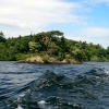 Derwentwater shore as seen from pleasure craft.