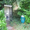 Modern phone box well hidden away in Weston on the Green