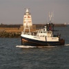 fishing boat returns to port