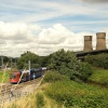 Sheffield supertram going into Meadowhall with the (now demolished) Tinsley towers and the M1