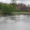View of Hampton Court Palace while crossing the Thames
