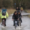 Cyclists in floodwater, the Parks, Oxford