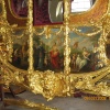Royal Mews.  A close-up of the artwork that adorns one side of the gilded coach. I assume the other side is the same.