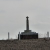 Monument to Saint Edmund in the middle of a ploughed field