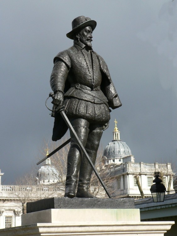 Sir Walter Raleigh statue at Greenwich with domes of Royal Naval College in background