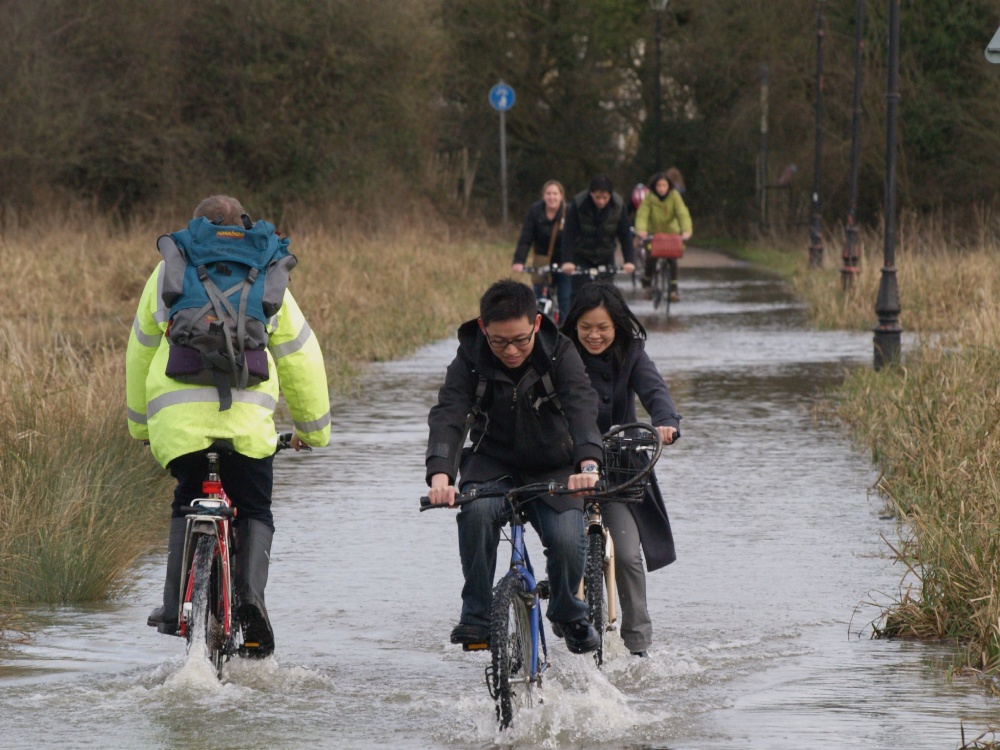 Cyclists in floodwater, the Parks, Oxford