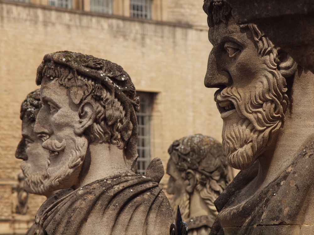Stone heads outside the Sheldonian Theatre, Oxford