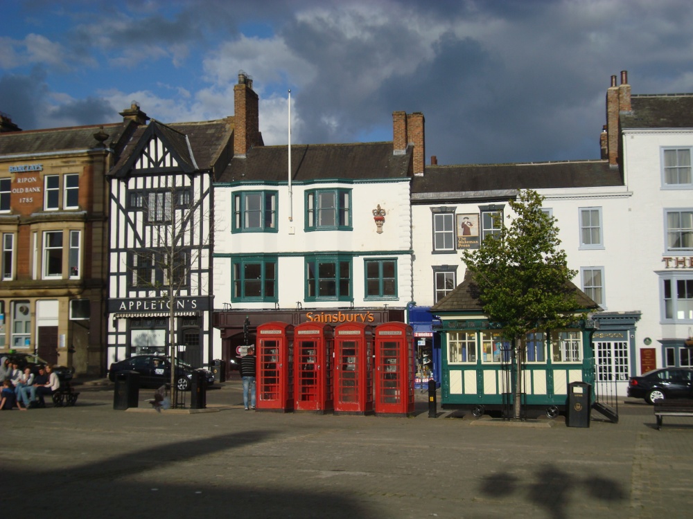 Four telephone boxes at Market Place
