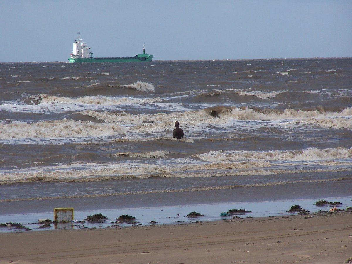 "Gormley Statue & tide, Crosby Beach, Sefton, Mersyside" by