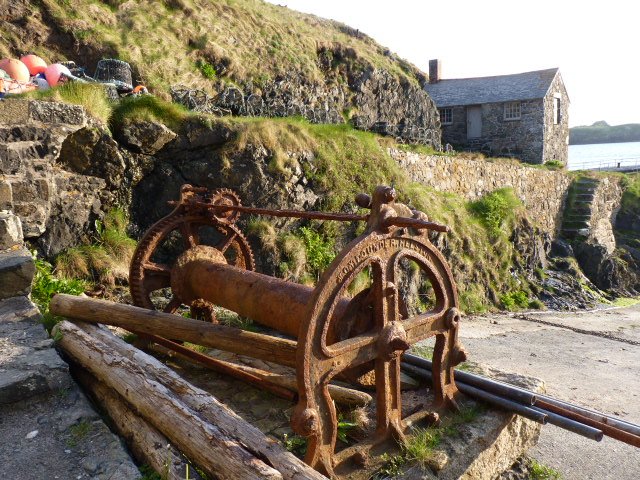 Rusting winch at Mullion Cove, Cornwall