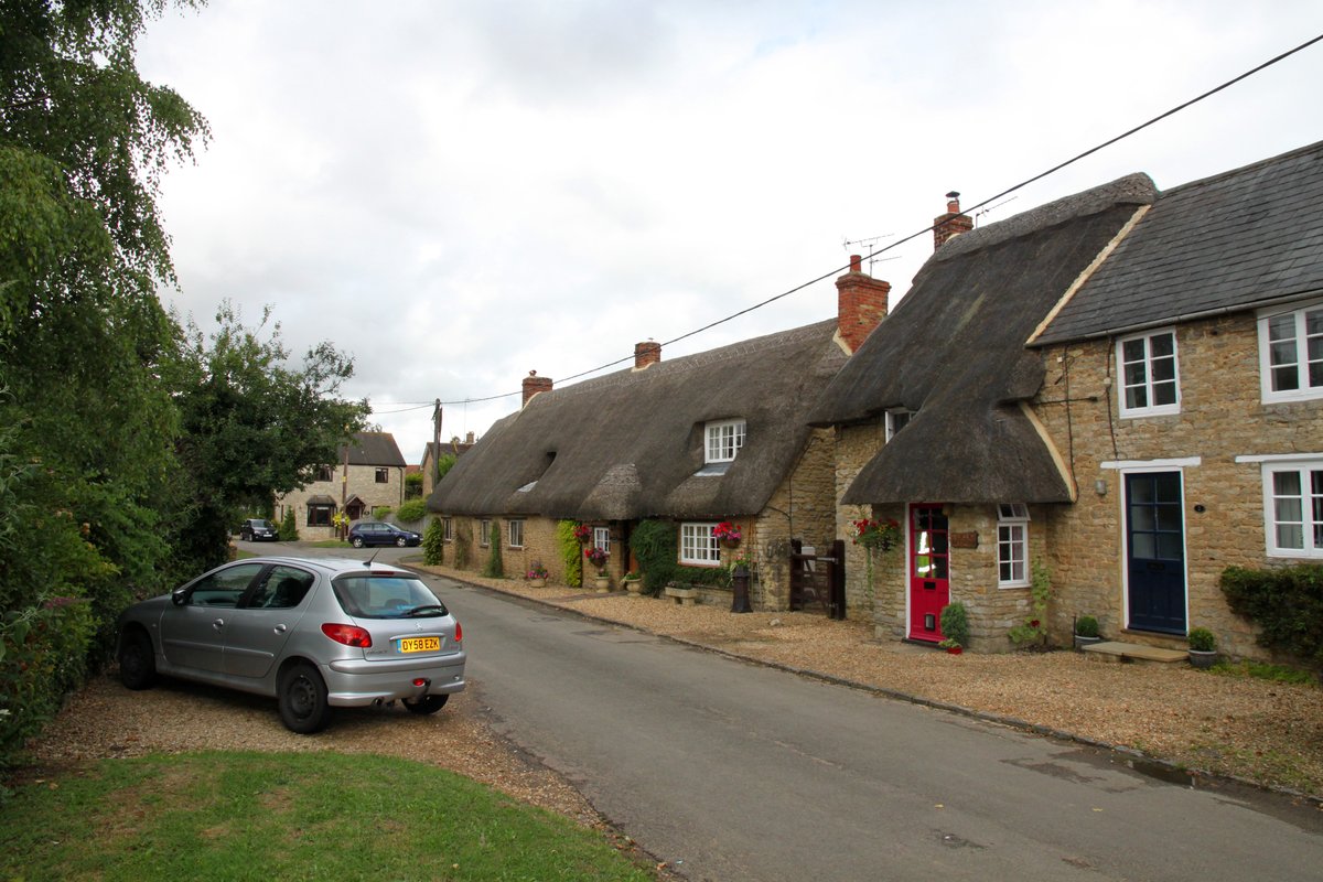 Pretty thatched cottages in Main Street, Fringford