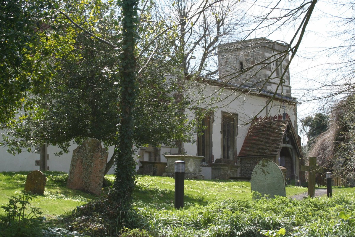 The Church of St. Michael and All Angels, Letcombe Bassett, set amongst the primroses in the churchyard