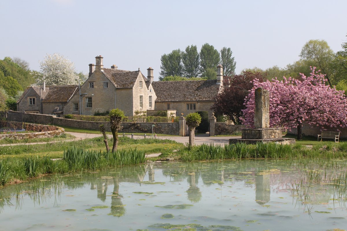 The manor house and village pond in Westwell